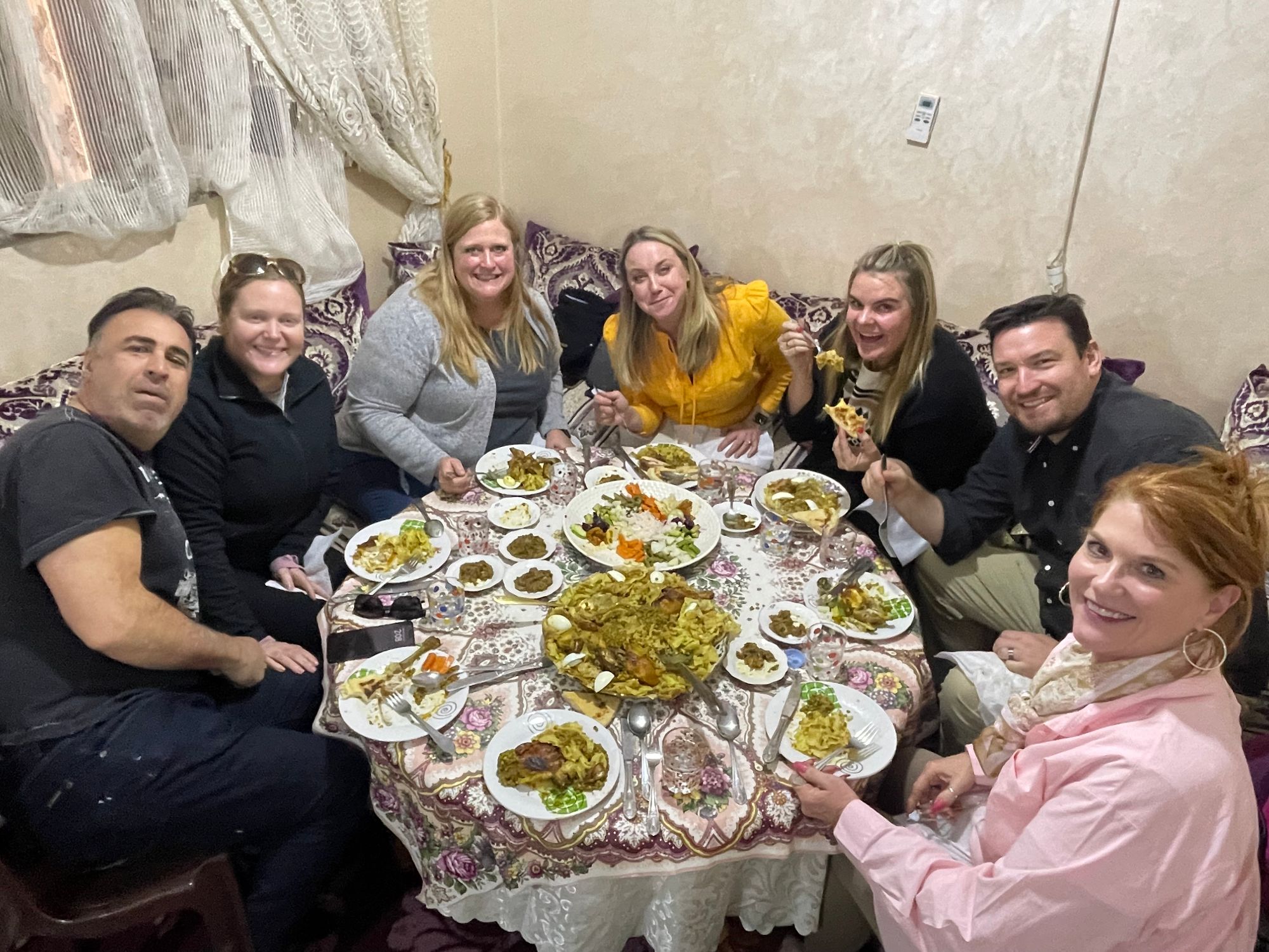 Katherine Friedman and seven others enjoy a traditional Moroccan meal together in a decorated dining room
