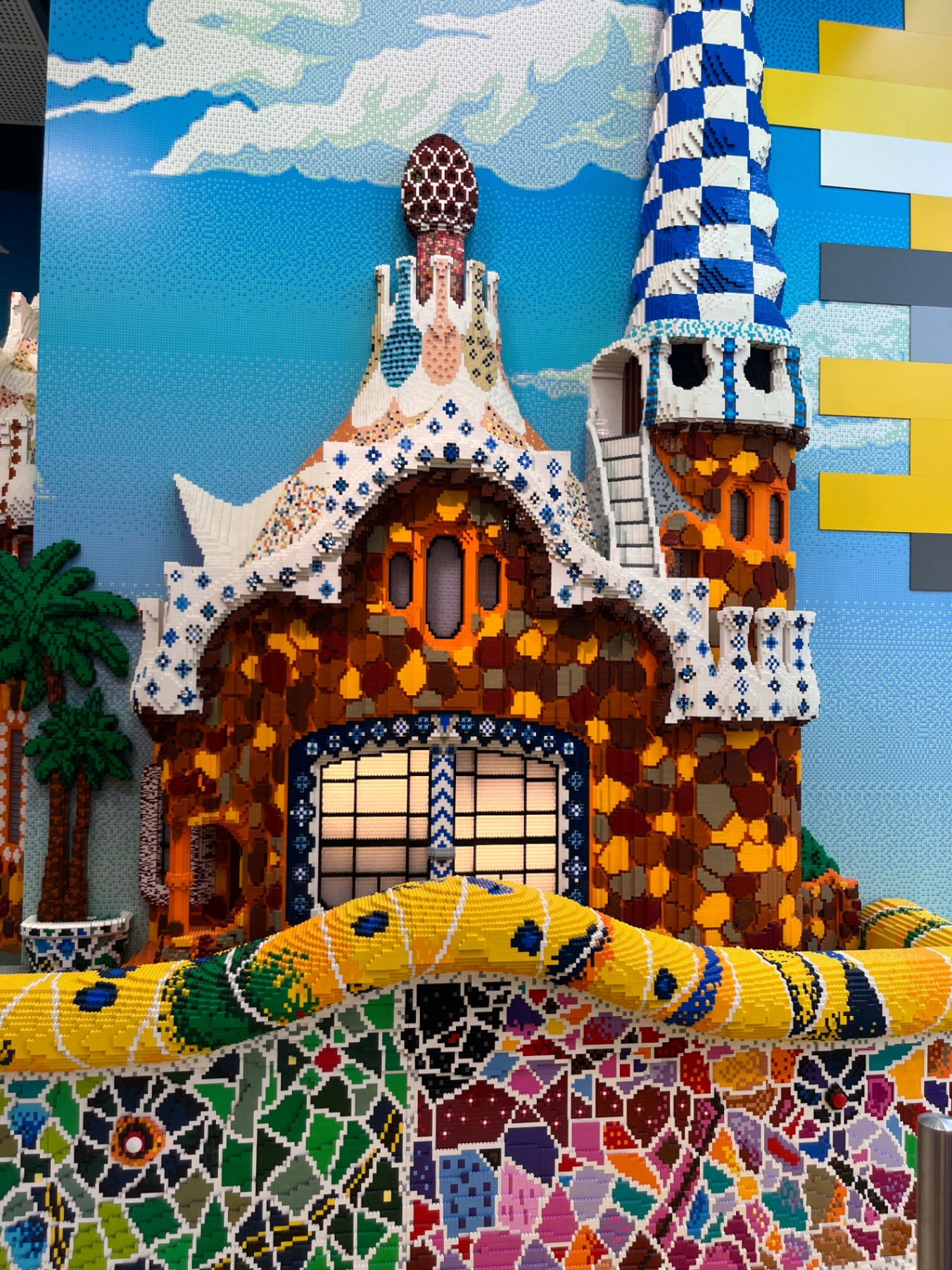 Gaudí's Casa Batlló building facade with organic stone work and colorful mosaic tile decorations