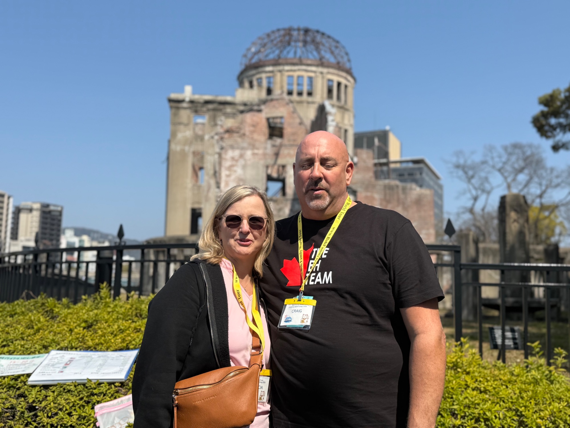 Woman in front of the Genbaku Dome, the atomic bomb memorial structure in Hiroshima