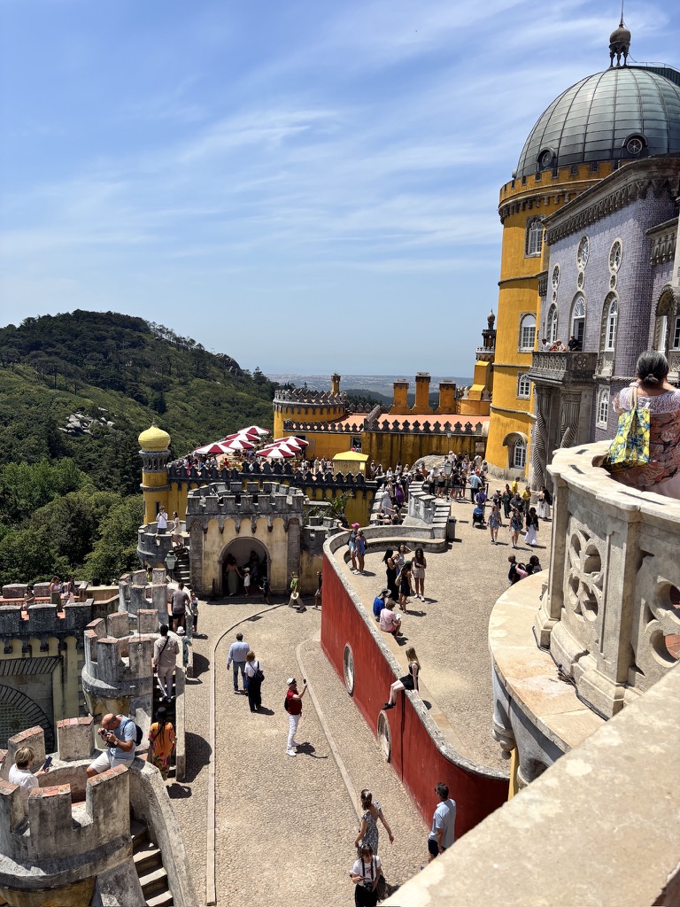 Colorful rooftop view of Palace Hotel Pena with yellow and white domed architecture in Sintra