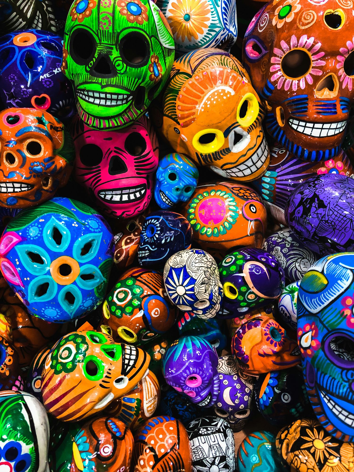 Social media sign promoting Day of the Dead fiesta at Sandos resort with skull logo