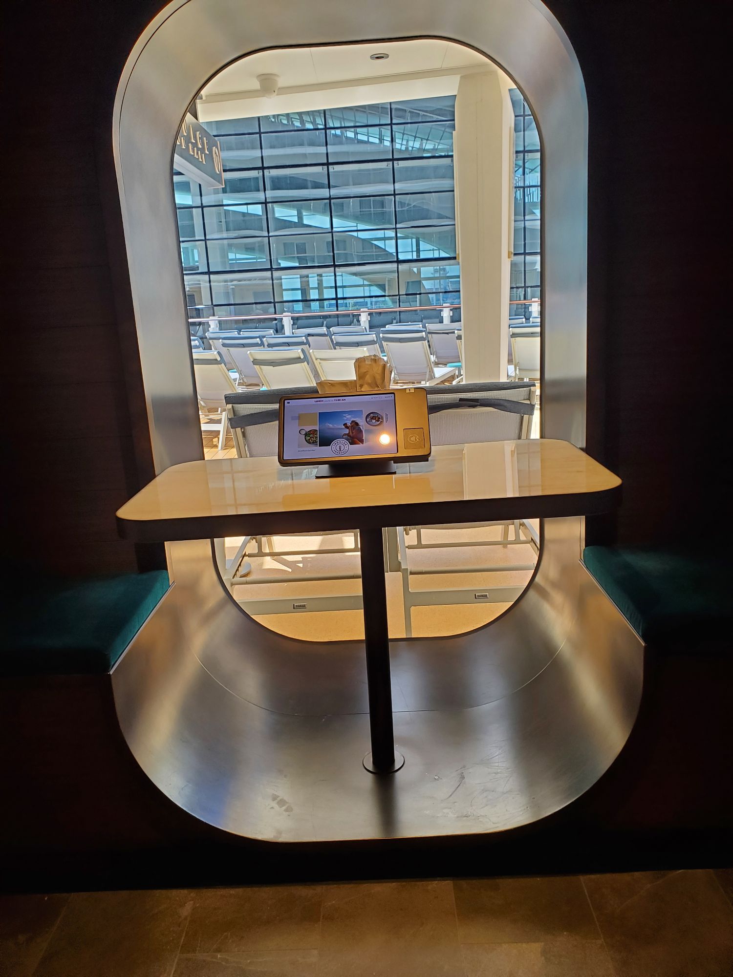 Interactive digital display showing Norwegian Luna ship model in modern cruise terminal